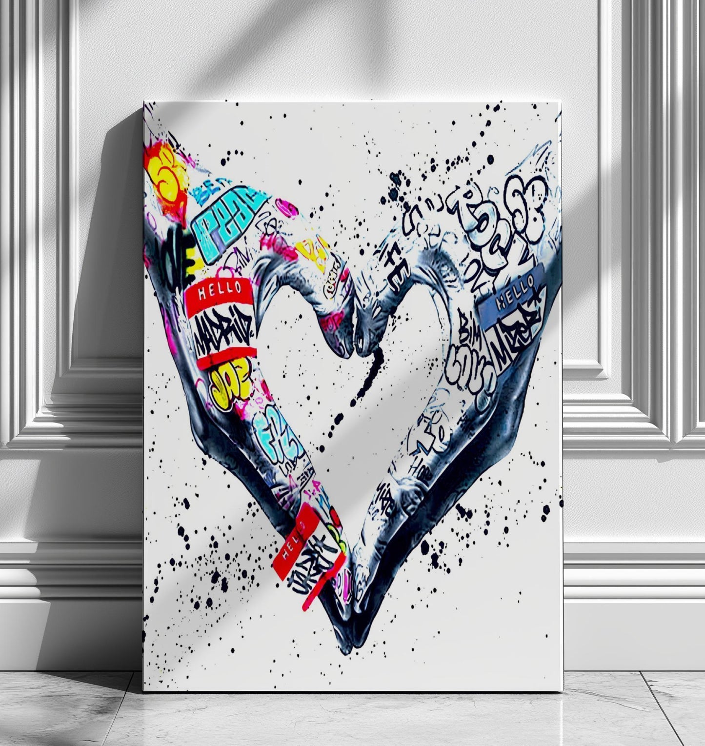 A powerful set of 2 graffiti prints symbolising world unity and connection through bold, expressive street art. One printed heart canvas features hands forming a heart shape, while the other showcases holding hands, both adorned with vibrant graffiti