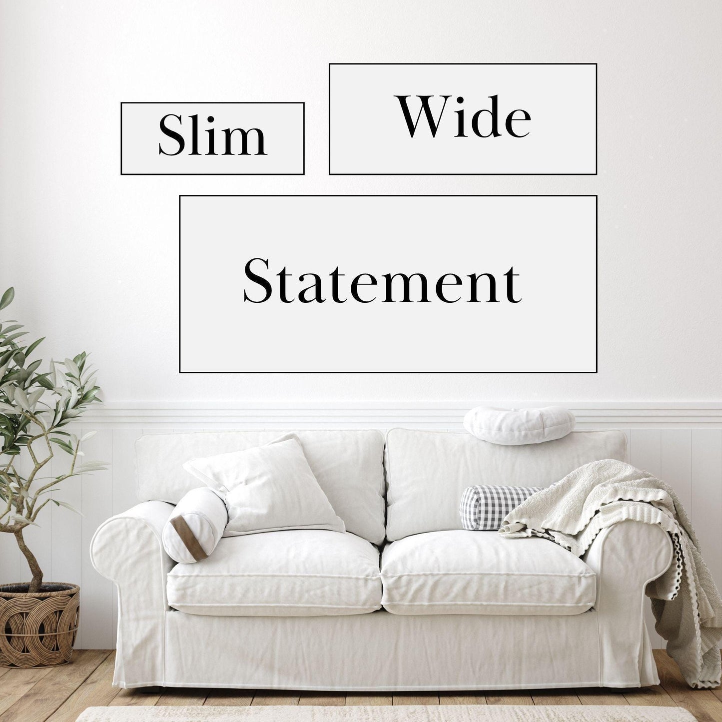 a white couch sitting in front of a white wall