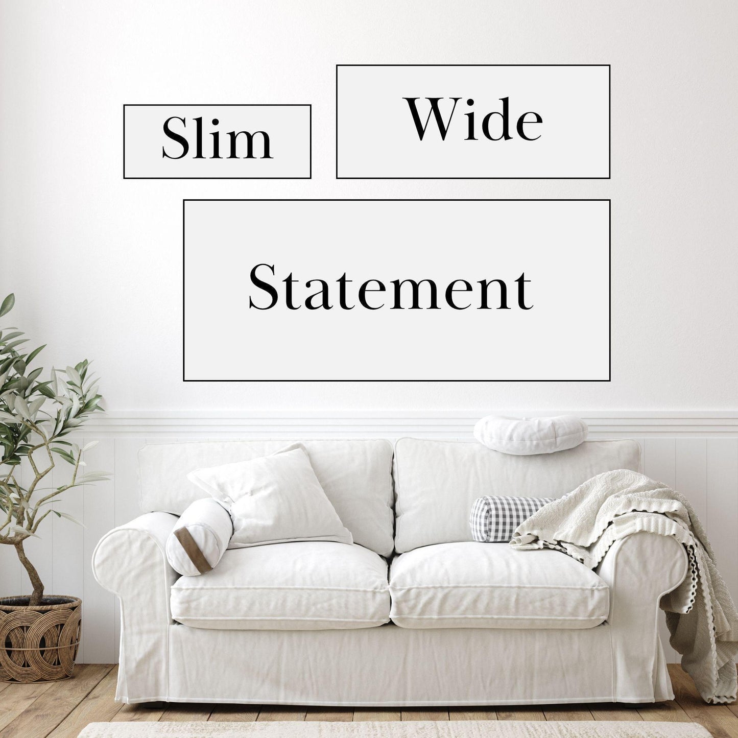 a white couch sitting in front of a white wall