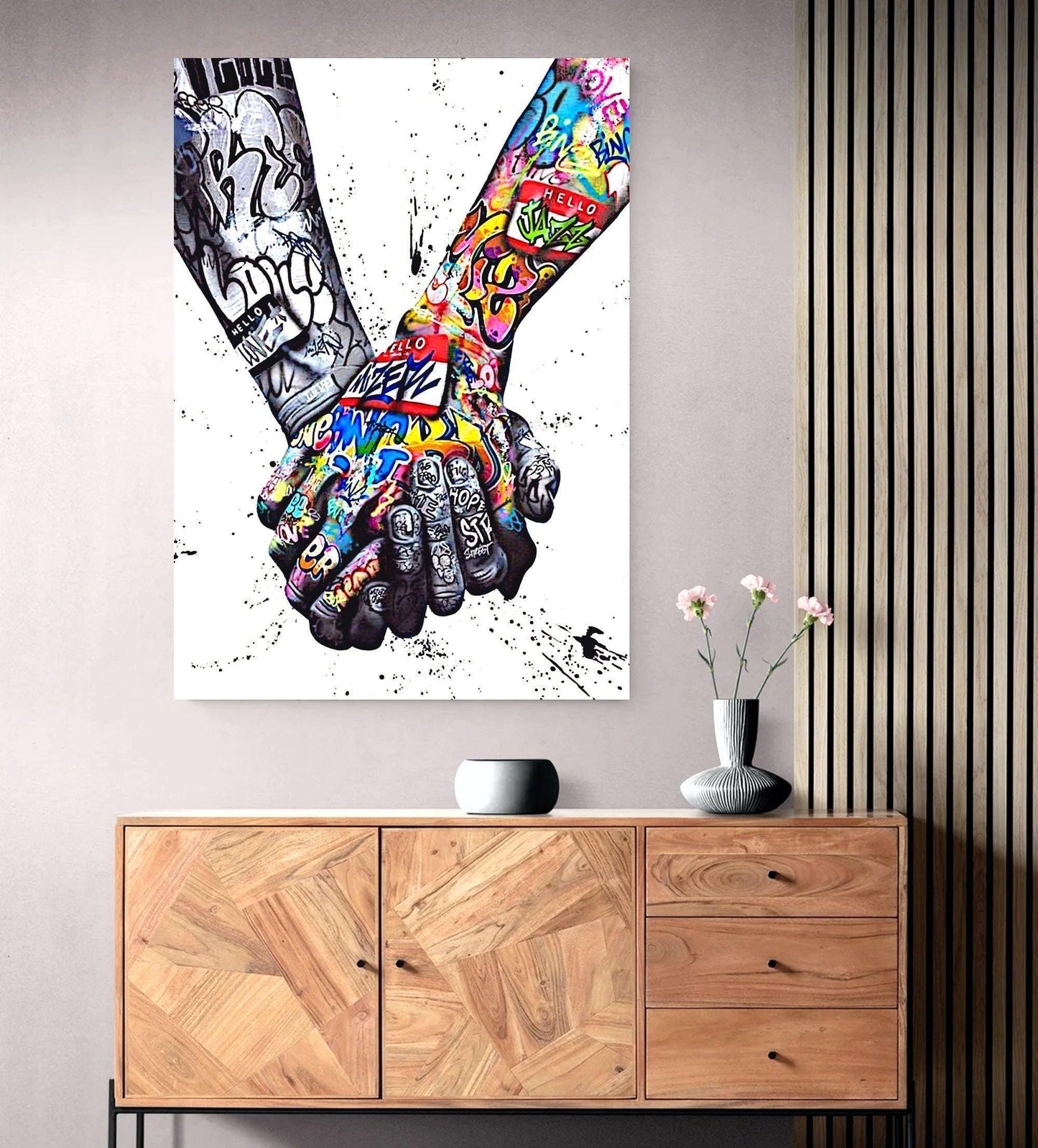 A powerful set of 2 graffiti prints symbolising world unity and connection through bold, expressive street art. One printed heart canvas features hands forming a heart shape, while the other showcases holding hands, both adorned with vibrant graffiti