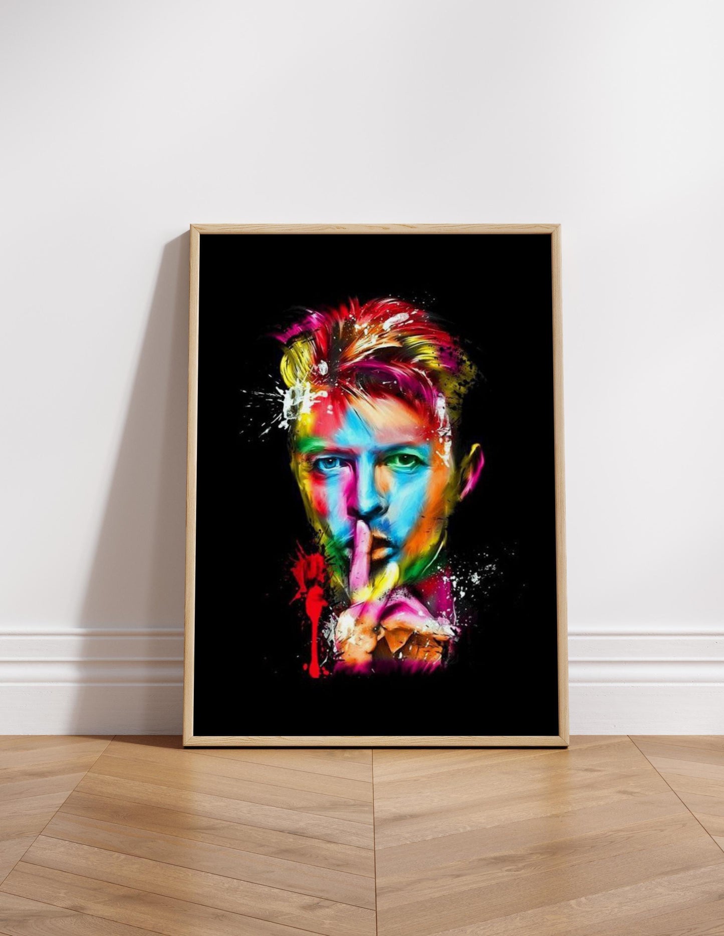 Colourful abstract pop art print of David Bowie, featuring vibrant splashes of paint on a black background. A striking Ziggy Stardust-inspired glam rock poster, perfect for music lovers and contemporary art enthusiasts. Ideal for canvas wall art or printed canvas decor.