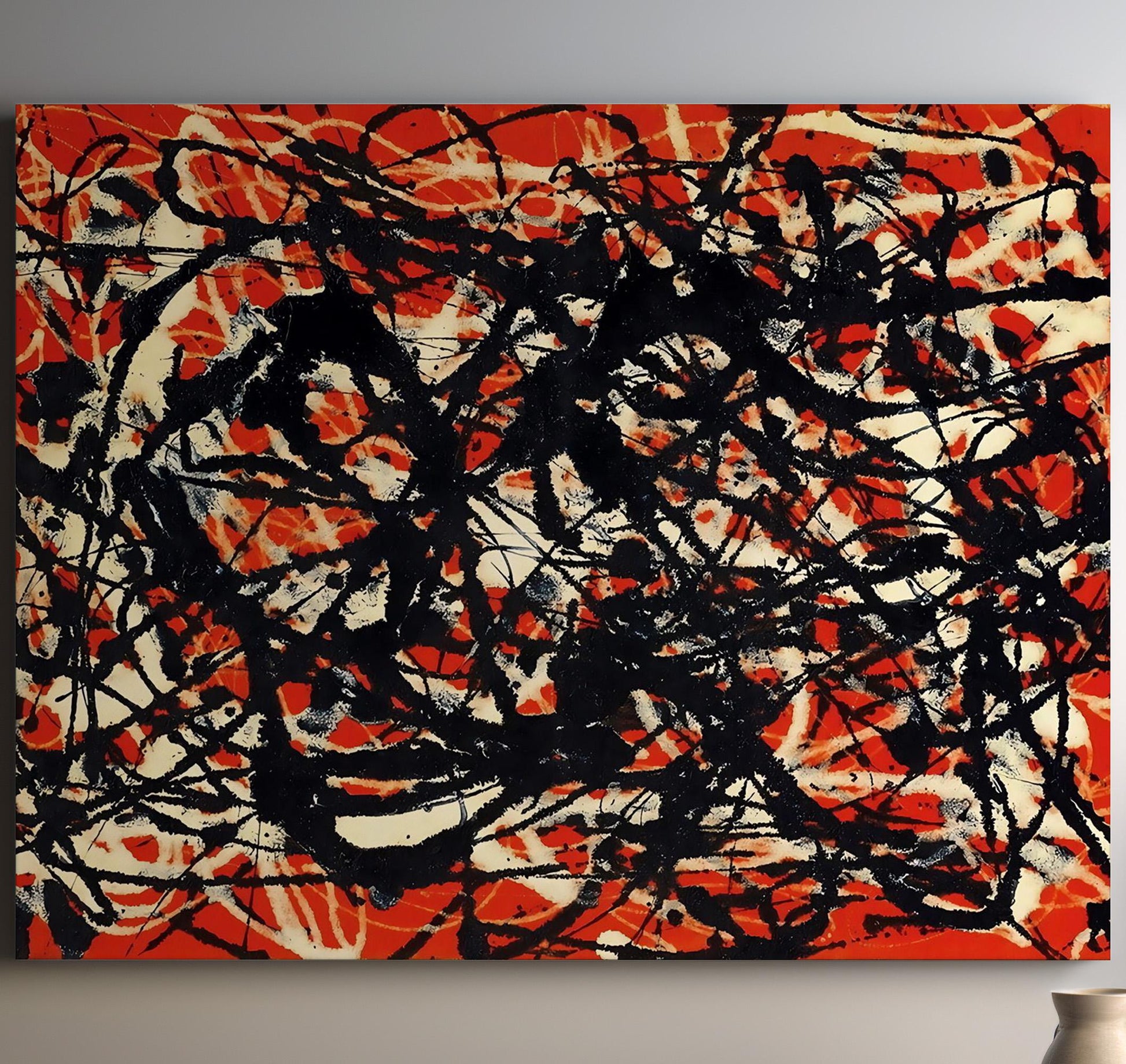 an orange and black painting on a wall