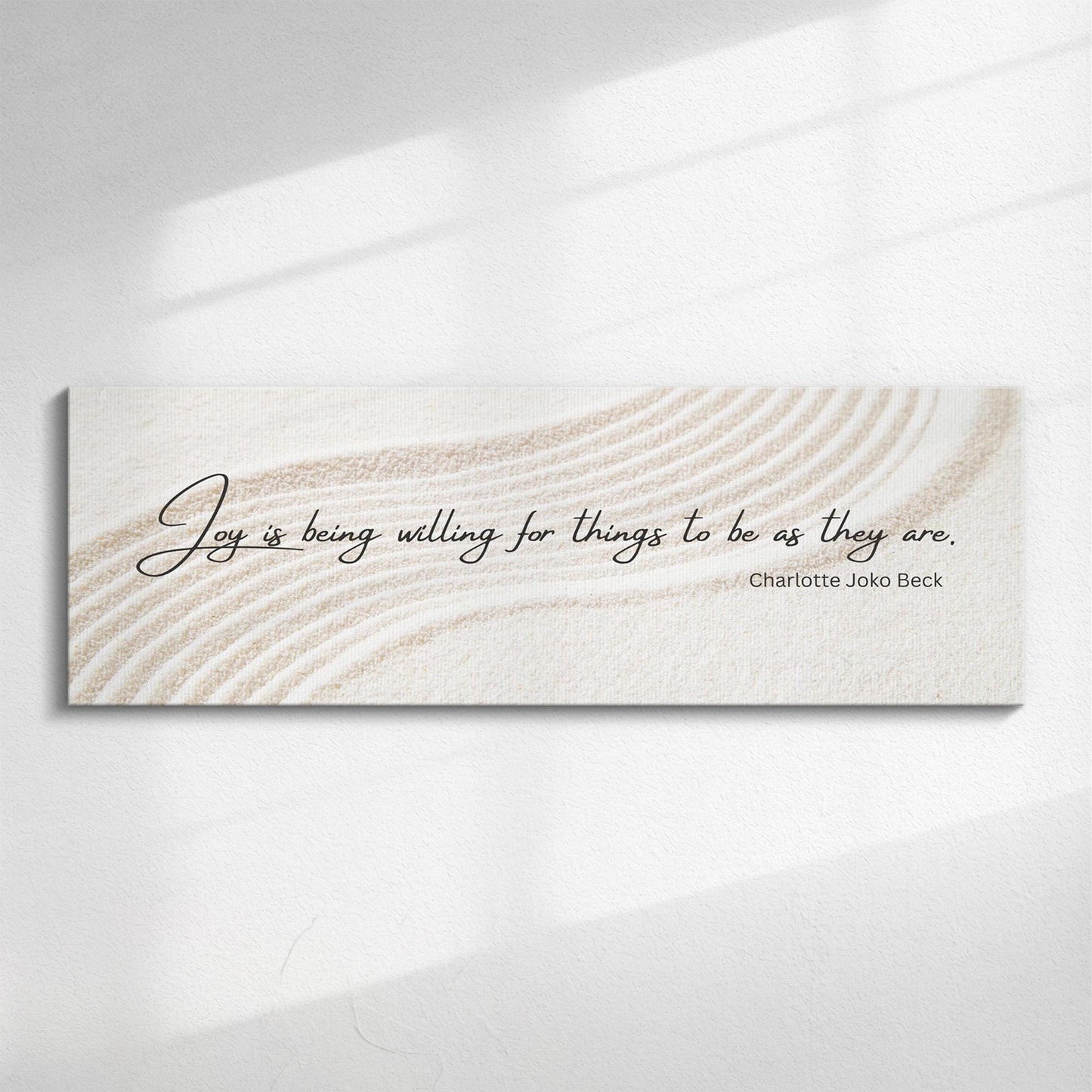 Panoramic canvas featuring a Zen Buddhist quote in calligraphy over a minimalist Japanese sand garden with soft, curved lines. Suitable for living rooms above sofa in modern UK home.