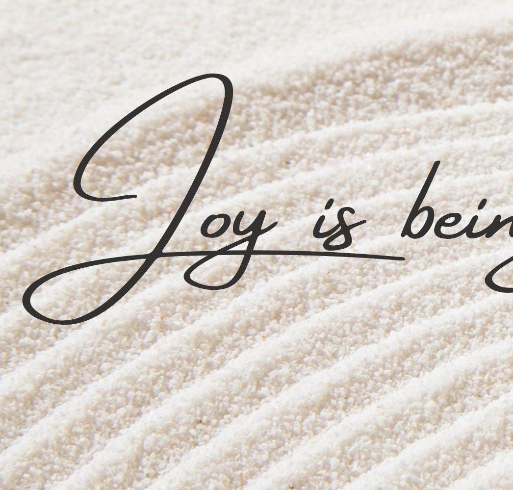 the word joy is being written on a mattress