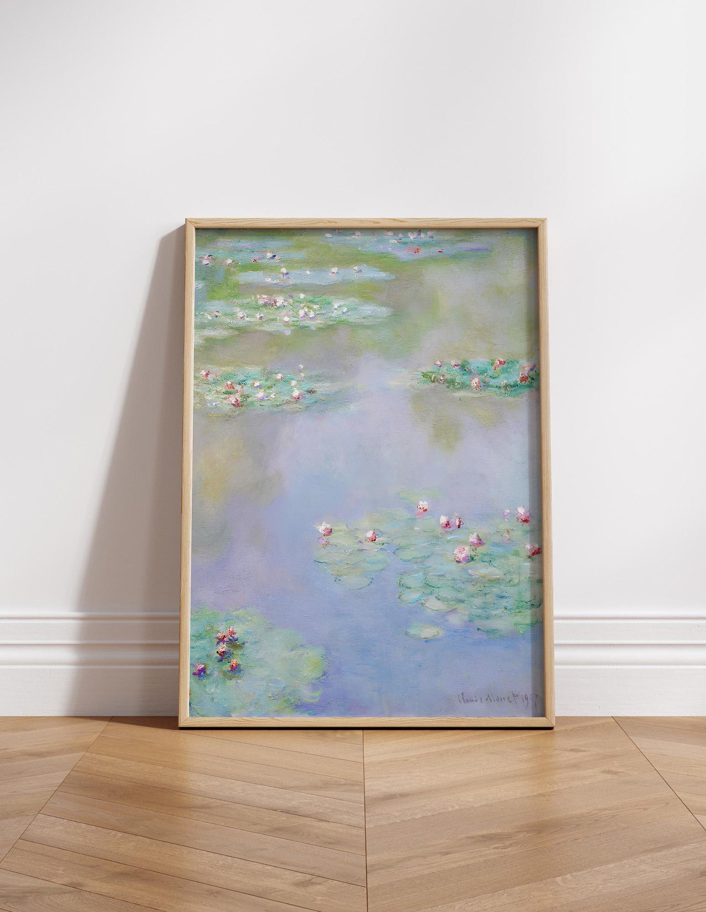 The image is a framed painting of water lilies, a famous impressionist artwork by the artist Claude Monet.