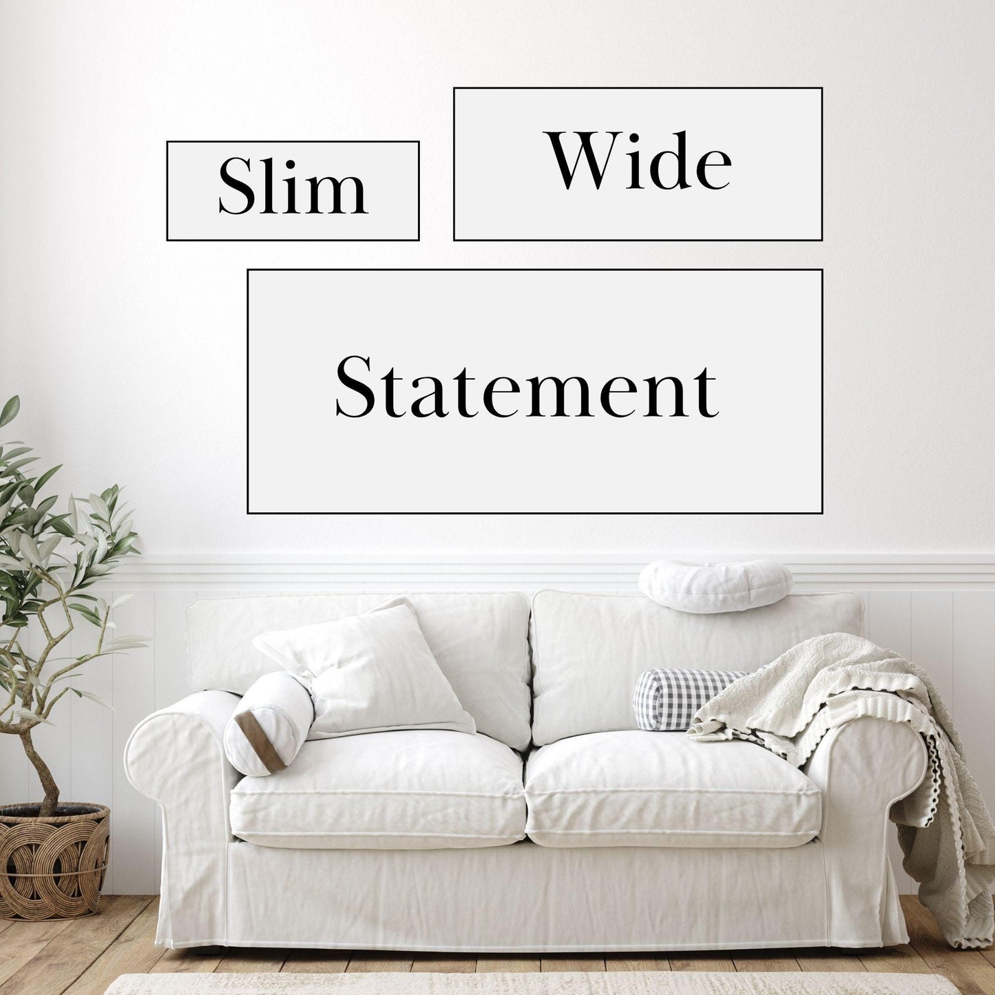 a white couch sitting in front of a white wall