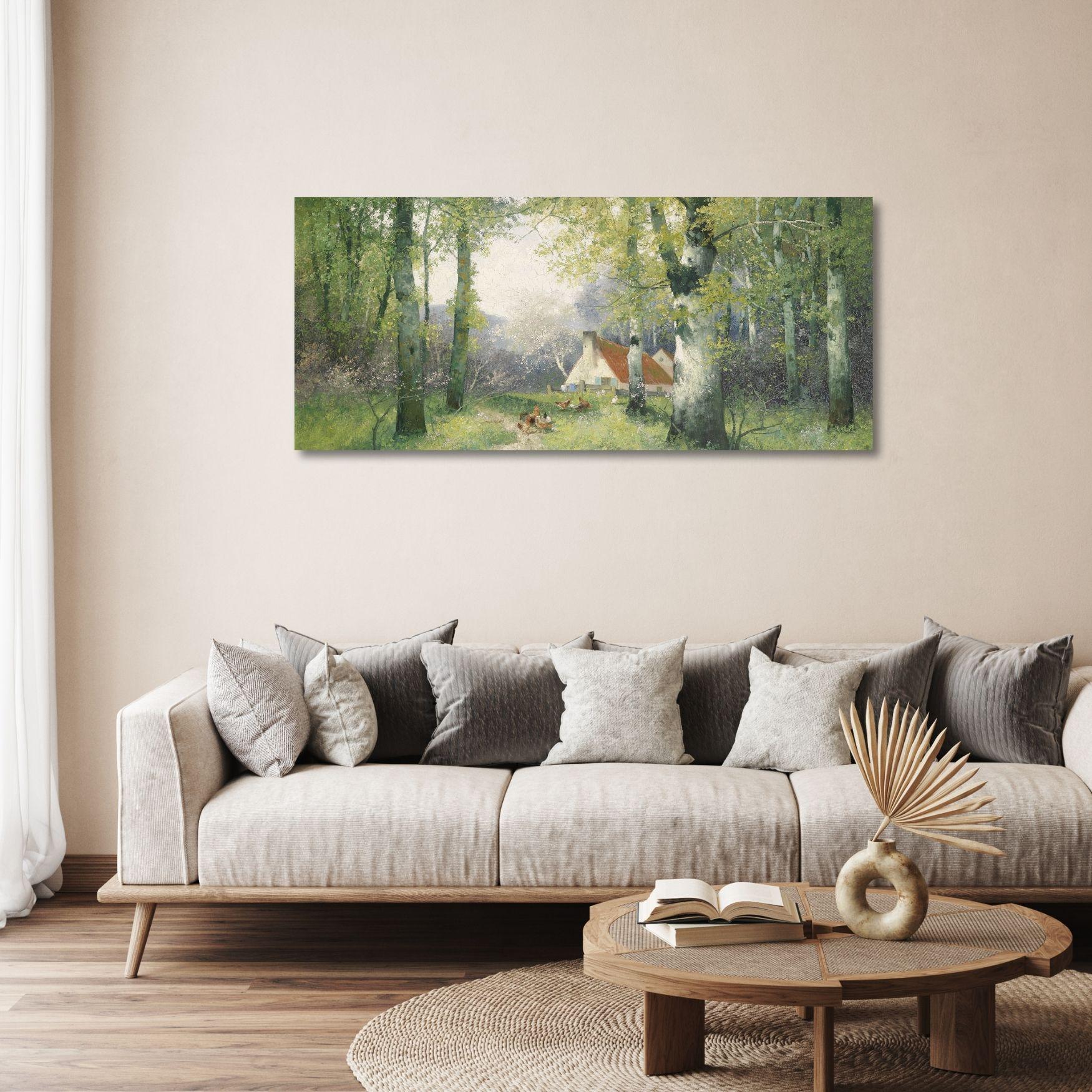 a living room with a couch and a painting on the wall