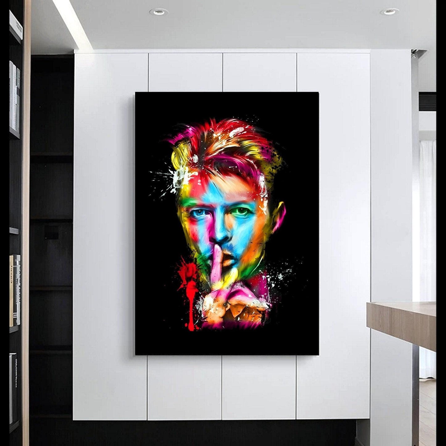 Colourful abstract pop art print of David Bowie, featuring vibrant splashes of paint on a black background. A striking Ziggy Stardust-inspired glam rock poster, perfect for music lovers and contemporary art enthusiasts. Ideal for canvas wall art or printed canvas decor.