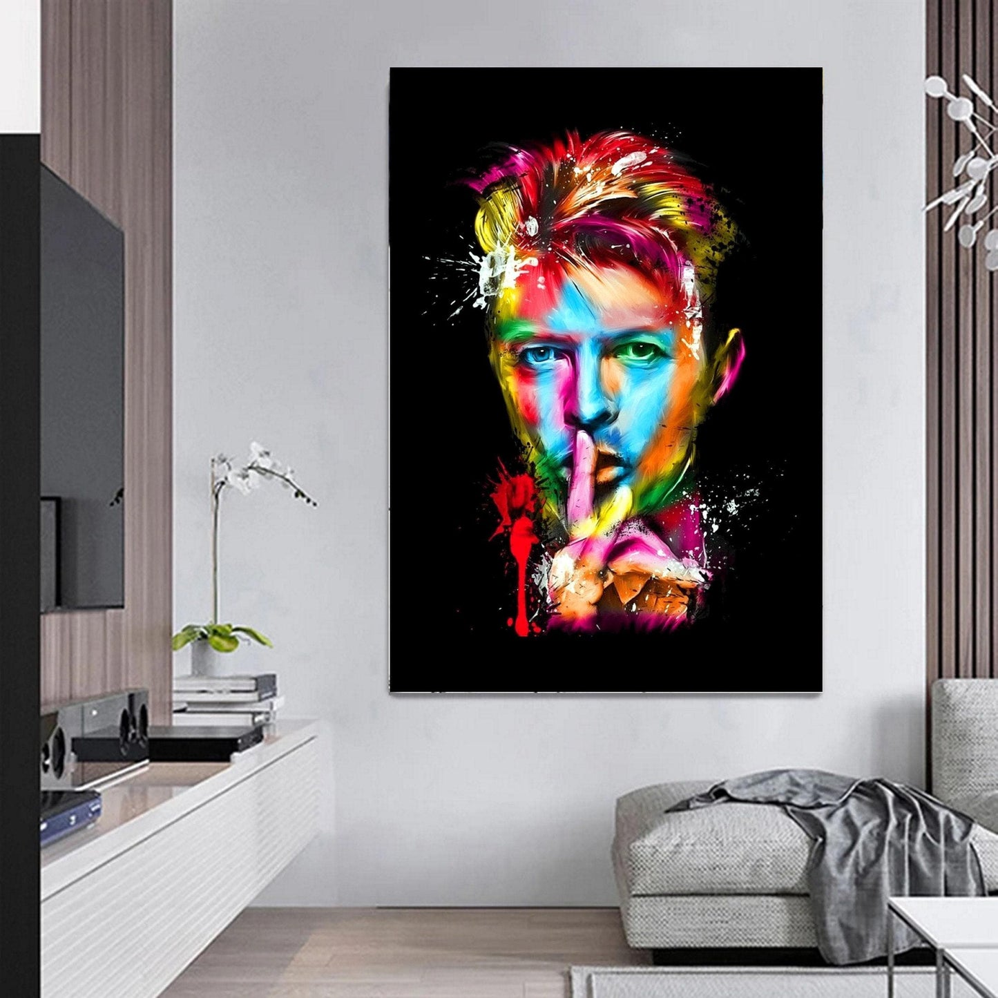 Colourful abstract pop art print of David Bowie, featuring vibrant splashes of paint on a black background. A striking Ziggy Stardust-inspired glam rock poster, perfect for music lovers and contemporary art enthusiasts. Ideal for canvas wall art or printed canvas decor.
