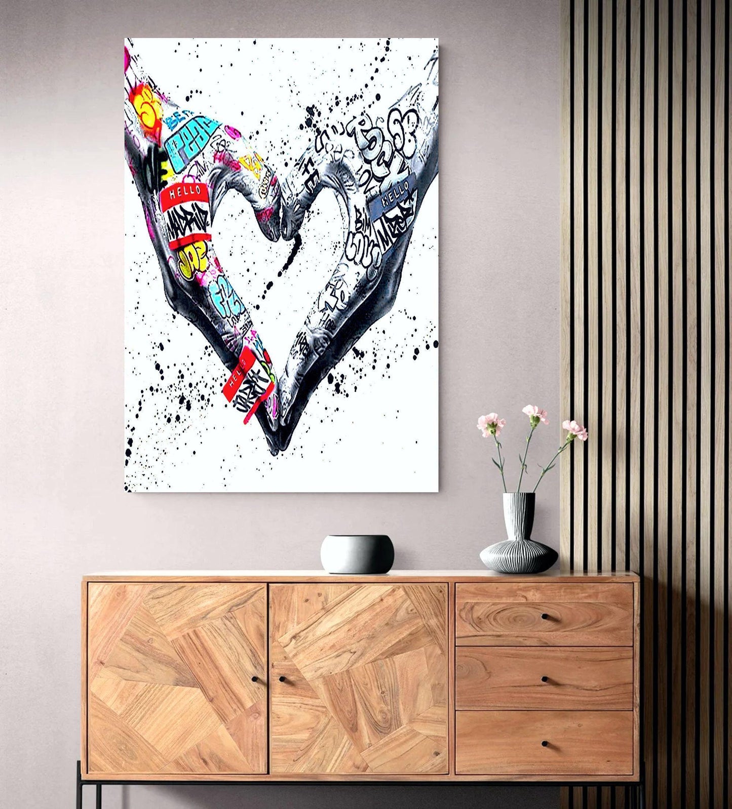 A powerful set of 2 graffiti prints symbolising world unity and connection through bold, expressive street art. One printed heart canvas features hands forming a heart shape, while the other showcases holding hands, both adorned with vibrant graffiti