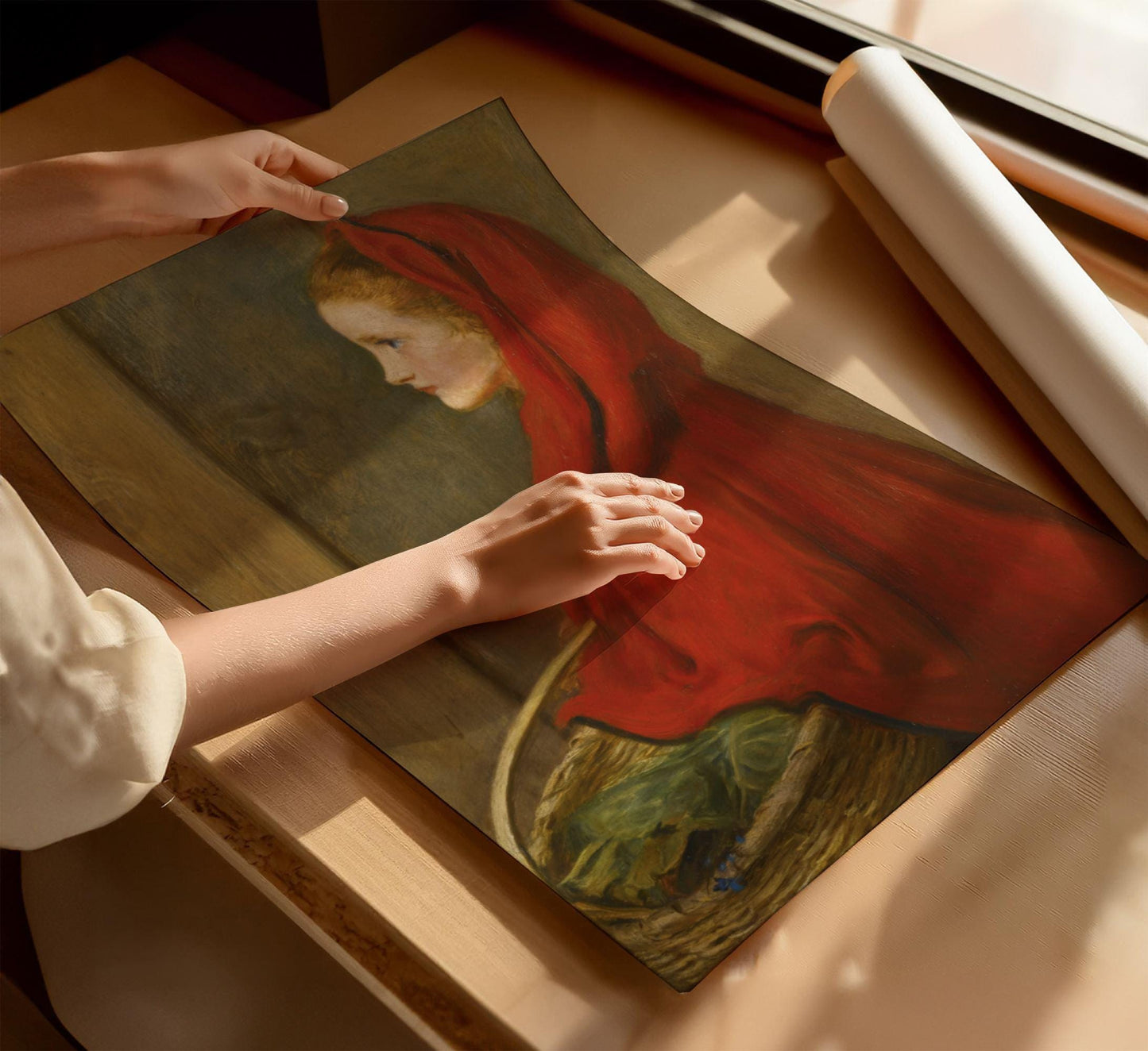 Unwrapping a poster Canvas wall art and poster of Millais Little Red Riding Hood oil painting by famous artist. The picture is appreciated by fine art lovers all over the world and bought as stretched canvases and poster prints.