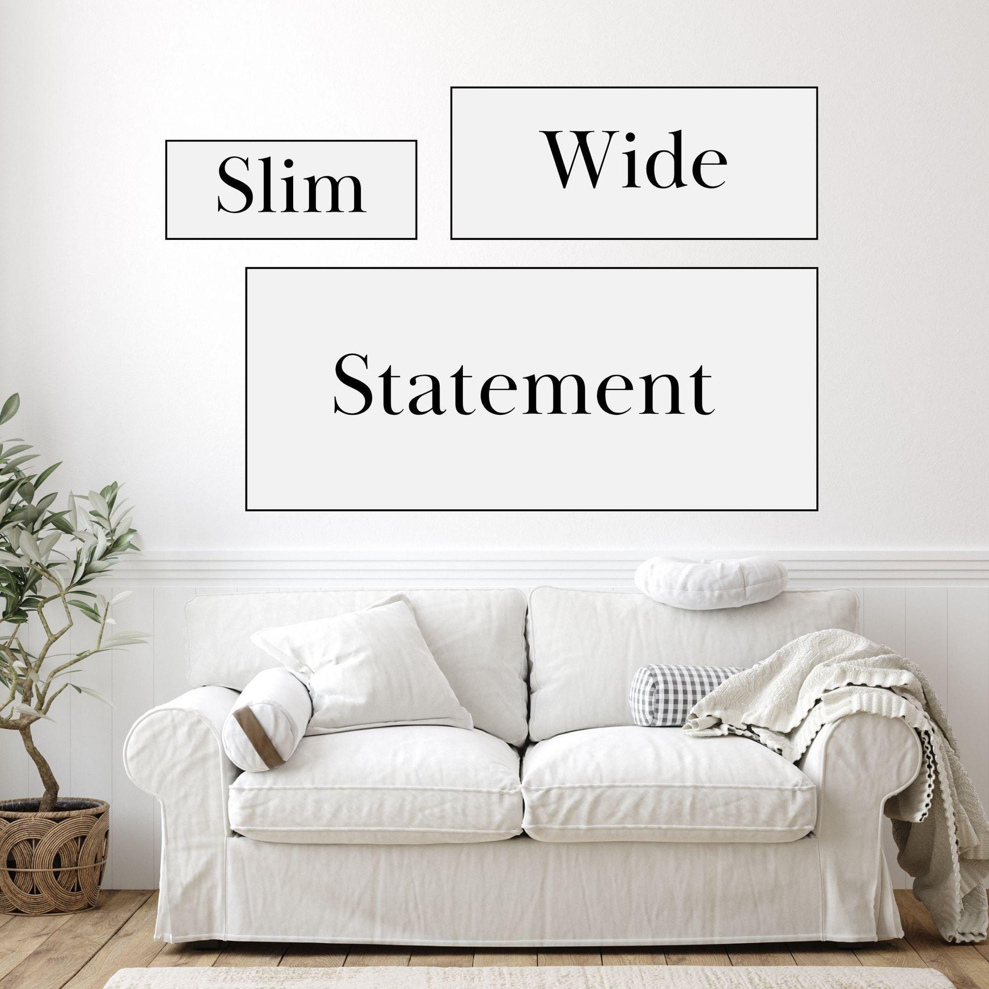a white couch sitting in front of a white wall