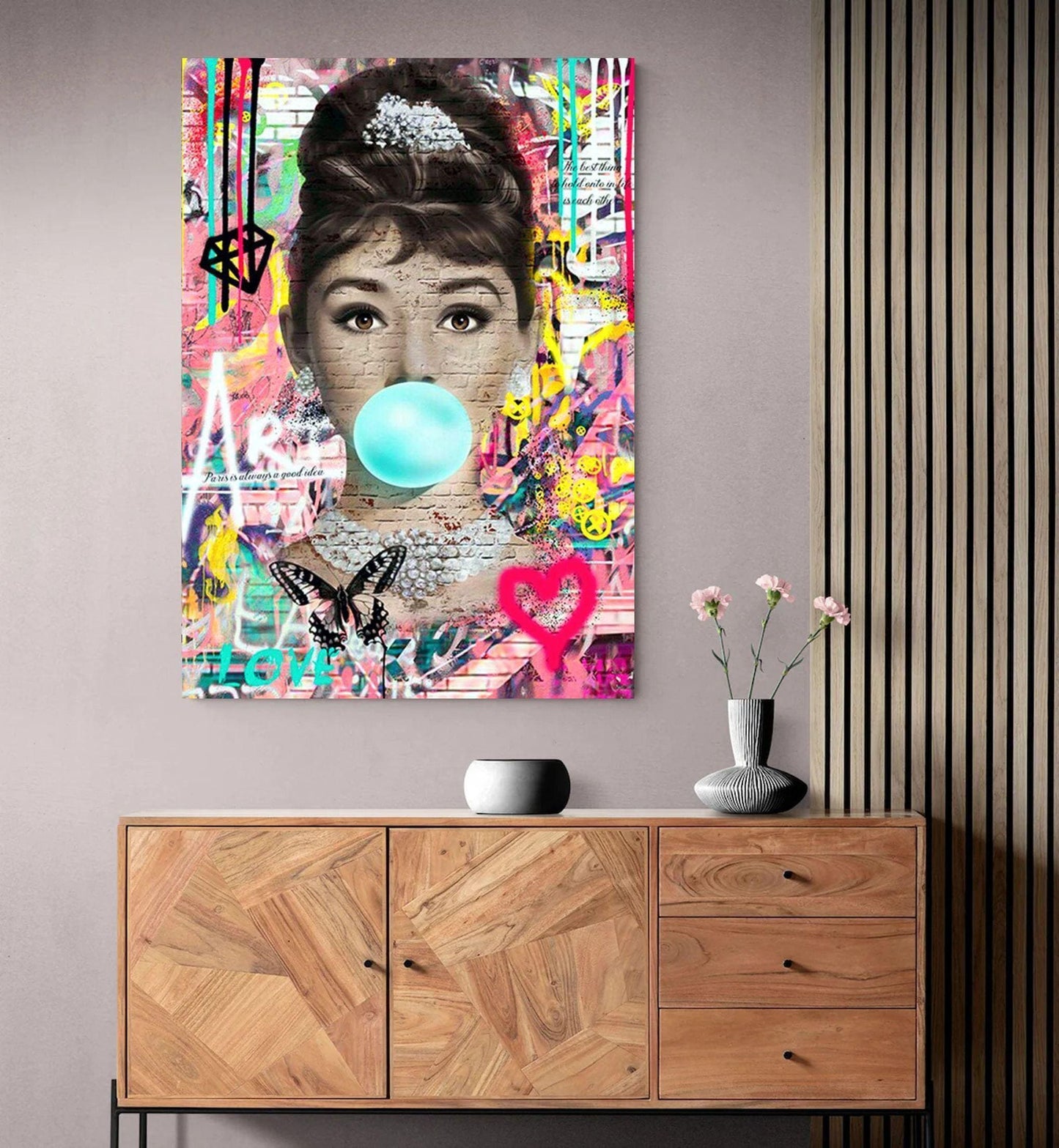 An iconic banksy style graffiti street art canvas of Audrey Hepburn. Also available as a poster print.