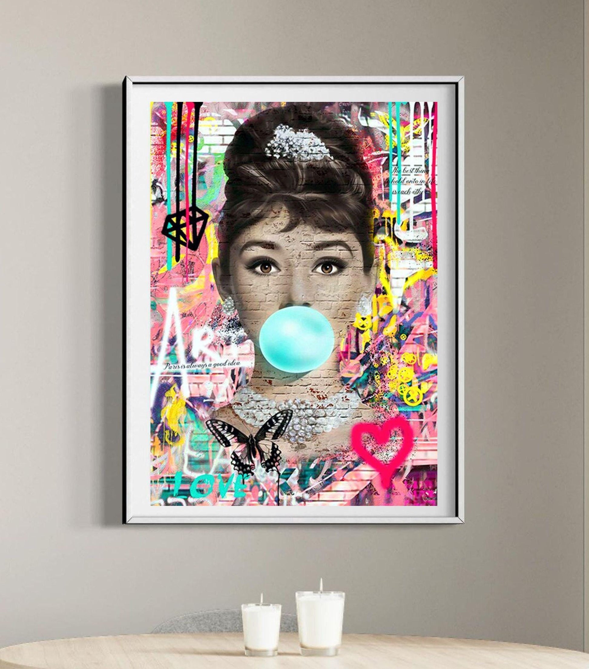 An iconic banksy style graffiti street art canvas of Audrey Hepburn. Also available as a poster print.