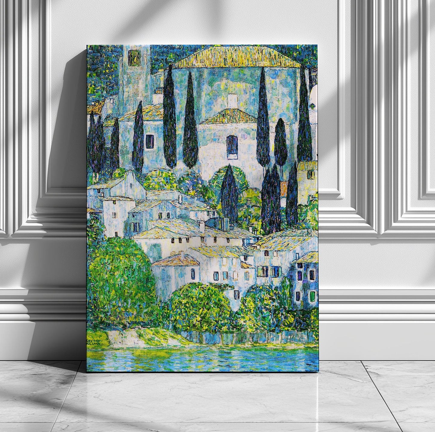 The image is a painting of a picturesque town with white buildings, green trees, and a body of water in the foreground.