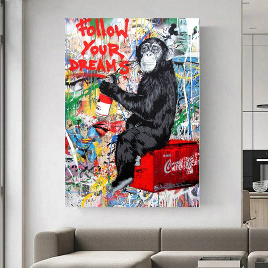 Colourful graffiti painting featuring a playful chimpanzee holding a spray can with the words &quot;Follow Your Dreams&quot; in bold red. A vibrant urban street picture inspired by Mr. Brainwash and Banksy canvas styles. Perfect for modern wall decor and printed on high-quality canvas.