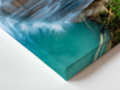a picture of a waterfall in the middle of a body of water