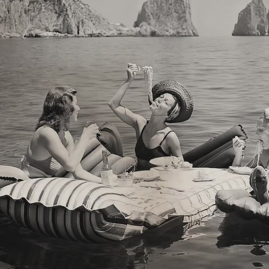 Three Women Eating Pasta On Water