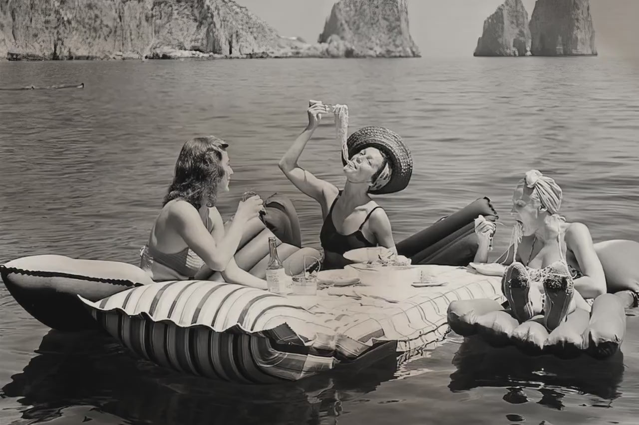 Three Women Eating Pasta On Water